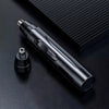 A sleek black professional electric nose and ear hair trimmer lying on a dark surface.