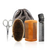 A set of boar bristle beard brush and comb with a gray fabric gift bag