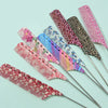 A set of anti-static rat tail combs in various pink, purple, and leopard print patterns.
