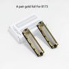 A pair of gold foil replacement shaver blades for model 8173, shown next to its packaging.