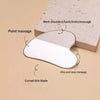 Outil gua sha en acier inoxydable en forme de cœur montrant divers points de massage comme le cou, les épaules et le menton.