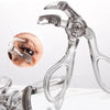 A clear professional eyelash curler set with multiple tools shown against a white background.