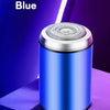 A silver compact electric beard trimmer is shown against a purple and blue background.