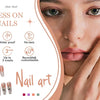Close-up of a hand displaying press-on nails with various nail art designs and features.