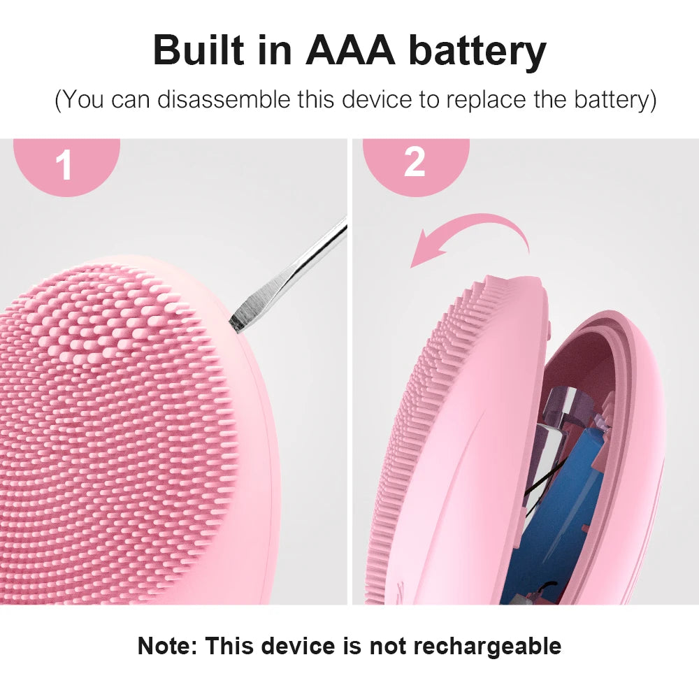 Pink electric sonic facial cleansing brush disassembled showing the battery compartment and brush head
