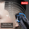 A close-up of a Kemel electric hair clipper demonstrating a gradient shape on a person's scalp.