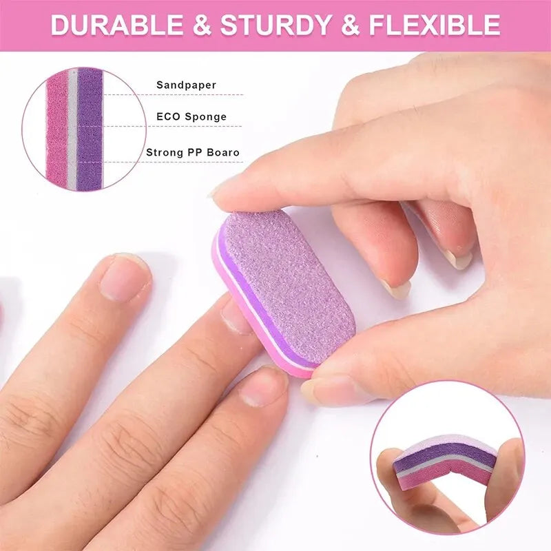 A hand holds a purple nail buffing block, showing its texture and durability against a background with sanding paper and spon