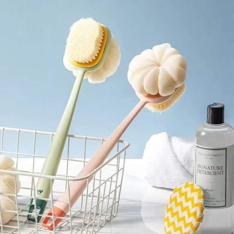 A long-handle loofah back scrubber with a soft mesh sponge and a natural white sponge are displayed in a wire basket.