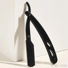A black stainless steel folding shaving razor set is shown against a white background.