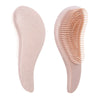 A pink detangling scalp massage hairbrush with fine bristles shown from the side.