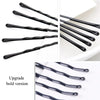 A set of black metal U-shaped hair pins shown in various angles and close-ups.