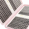 A pink plastic box containing a tool for applying bulk cluster eyelash extensions.