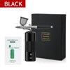 A black mini air compressor nail art spray tool is shown next to its packaging box.