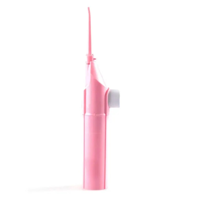 Irrigateur dentaire portable rose manuel à haute pression avec une buse longue et fine.