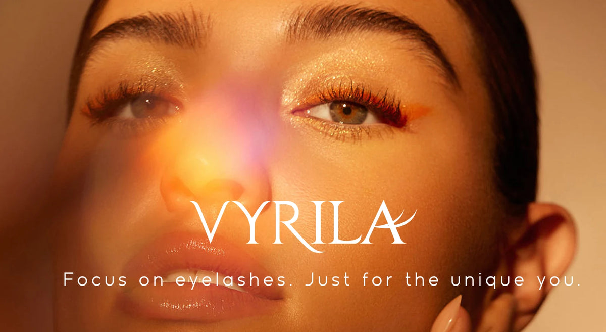 Close-up of a woman's eye with long, wispy eyelashes, featuring the brand VYRILA.