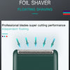 A close-up view of a green electric foil shaver with floating shaving technology.