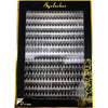 A tray of mixed false eyelashes displayed in a black box with gold accents.