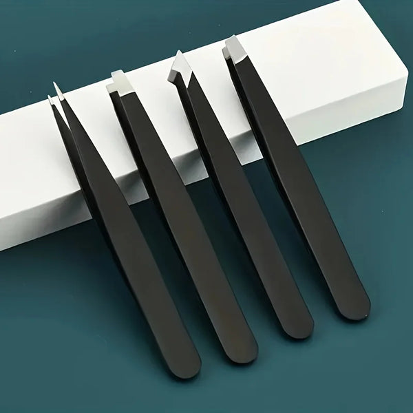 A set of black and silver precision stainless steel tweezers lying on a white rectangular surface.