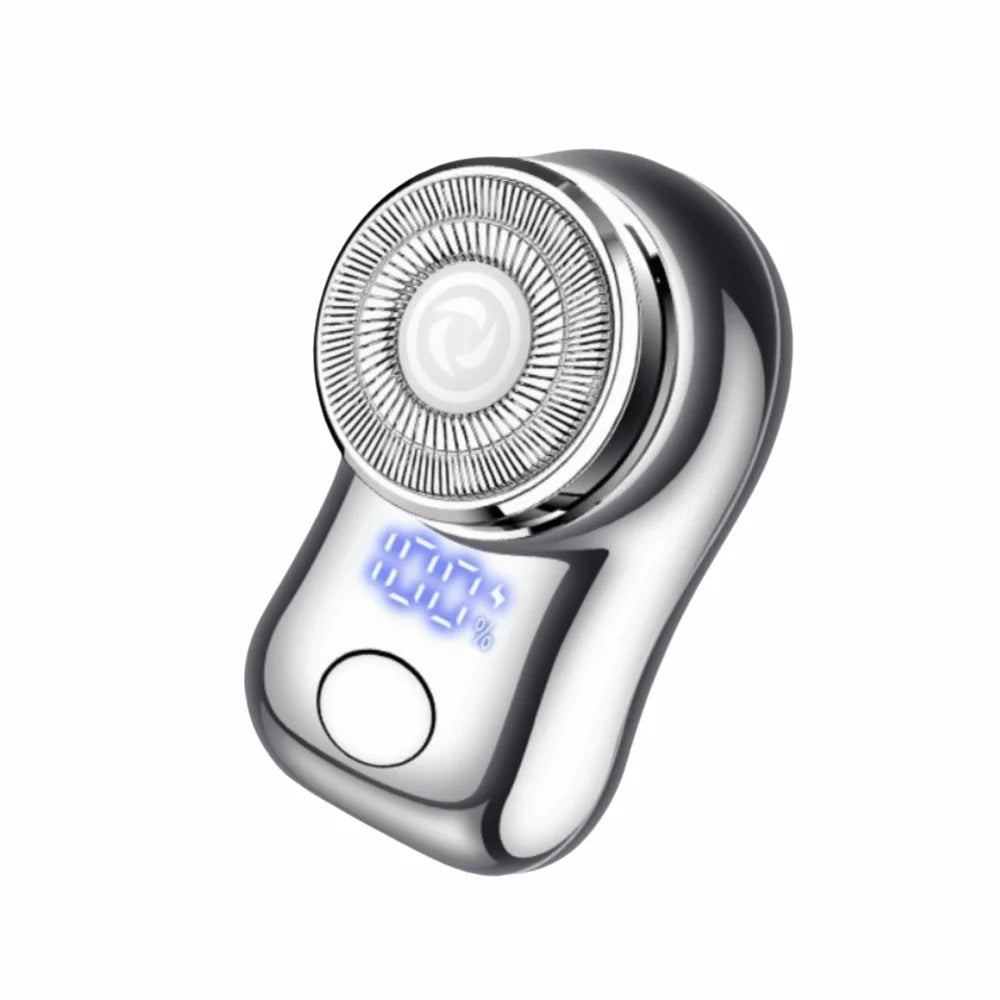 A close-up view of a silver cordless electric beard trimmer shaver with a rotating head and a blue indicator light.