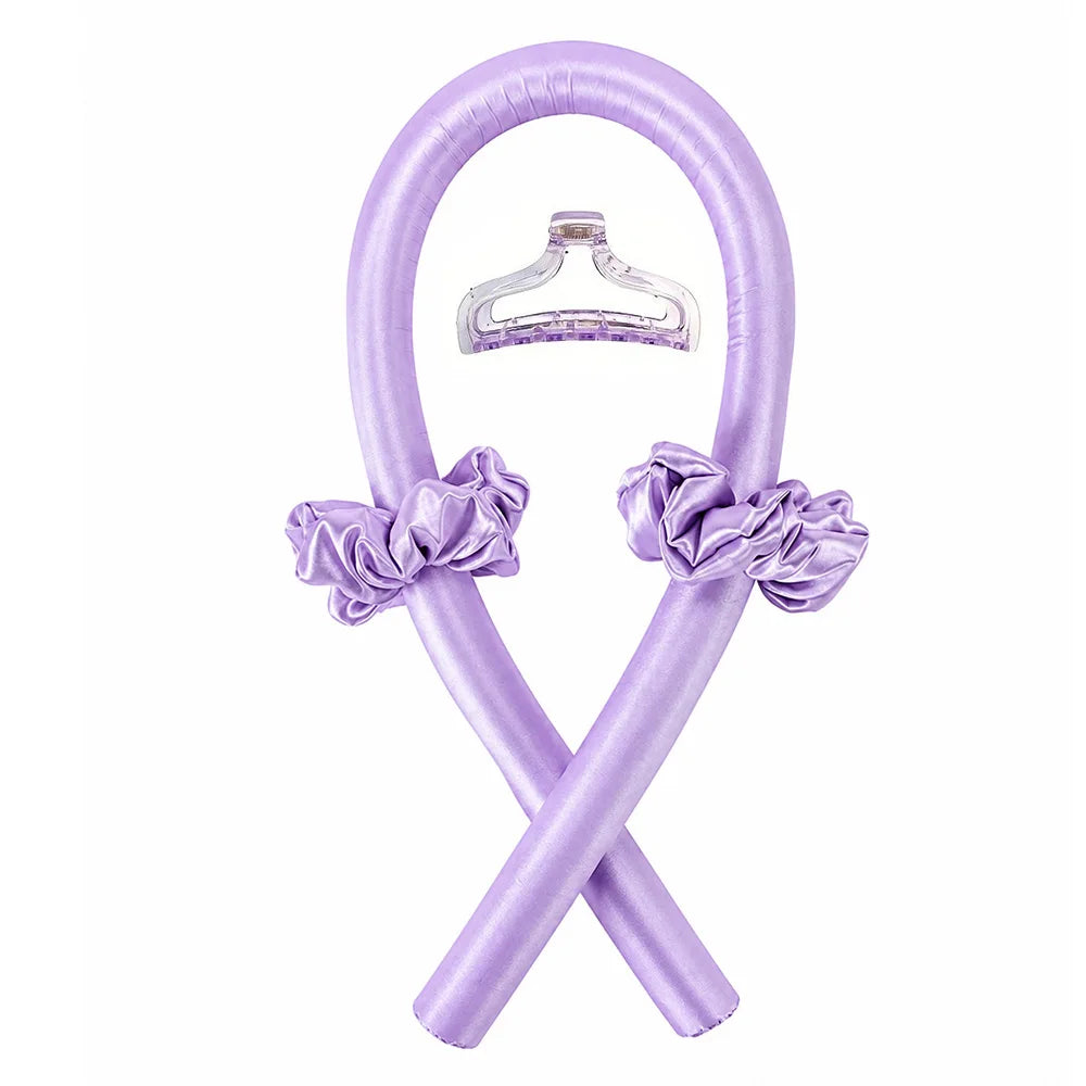 A purple satin heatless curling set with a bow, shaped like an 'X', for creating overnight waves.