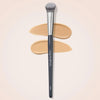 A precision concealer brush with a black handle and grey bristles is shown against a light background.