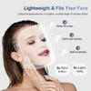 A woman is wearing a clear silicone facial mask designed to fit her face for skin tightening.