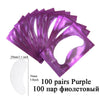 A fan of purple under-eye lash application patches, showing the size and quantity.