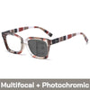 Pair of stylish photochromic multifocal reading glasses with tortoiseshell and brown stripes.