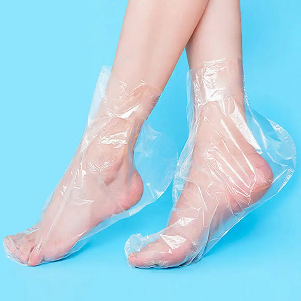 Pair of clear disposable foot moisturizing socks shown on a light blue background.