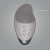 A close-up view of a sleek, silver facial cleansing brush with a textured silicone head and control buttons.