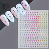 A set of laser gold and silver 3D alphabet nail art stickers featuring letters like T, L, O, V, E, Y, O, U, and Z.