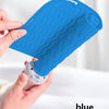 A hand holds a bright blue silicone heat resistant mat for hair styling tools.