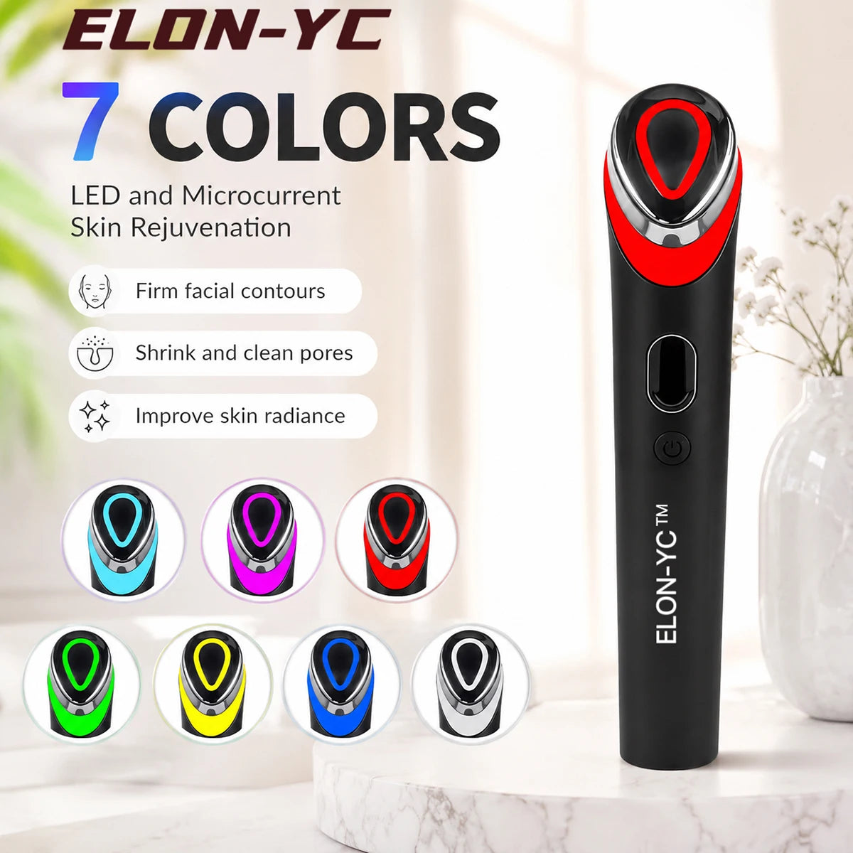 A black microcurrent face massager with seven color options displayed next to a white vase.