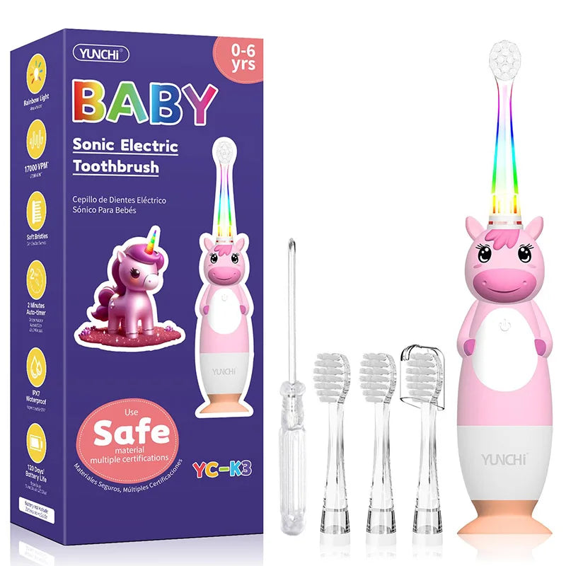 A box of YUNCHI Baby Sonic Electric Toothbrush with a pink unicorn design and several brush heads.