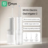 White MIJIA Electric Oral Irrigator 2 device with a large water tank and various nozzles displayed on a light background.