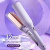 A close-up of a white electric curling iron with a rose gold barrel, shown against a purple background.