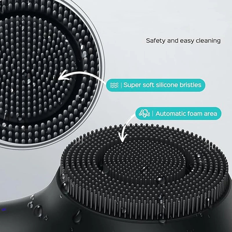 Close-up view of a black facial cleansing brush with super soft silicone bristles and an automatic foam area.