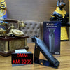 A black professional hair clipper with a yellow and black body is displayed next to its packaging.