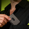 A hand holds a compact foil shaver in a black shirt, with text indicating its ease of carrying and suitability as a home or t