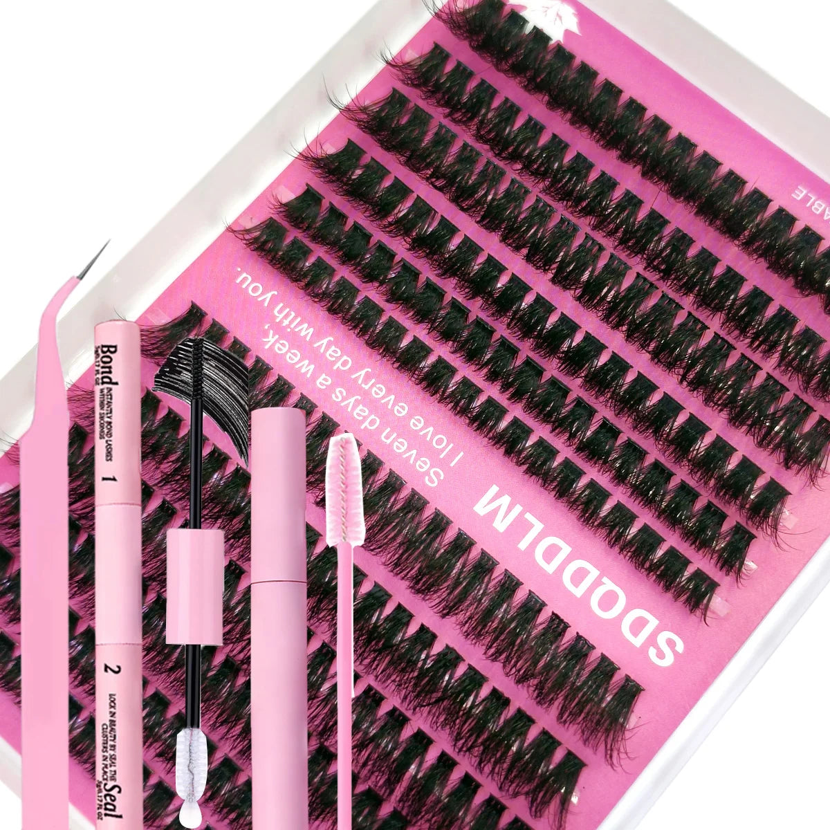 A pink kit containing lash extensions and tools for DIY lash application.