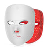 A white facial rejuvenation mask with a red LED light panel attached, shown from the front.