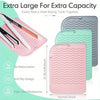 Pink and green silicone mats designed to safely rest two heat styling tools together for extra capacity