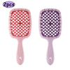A pair of professional detangling hair brushes, one pink and one purple, shown against a white background.