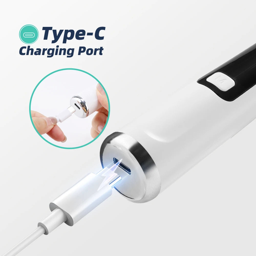 A close-up view of a Type-C charging port on a white ultrasonic dental scaler device.