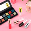 A collection of refillable lip gloss tubes in various shades and clear containers displayed on a pink background.