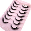 Plateau en plastique rose contenant divers styles de faux cils de renard noirs.