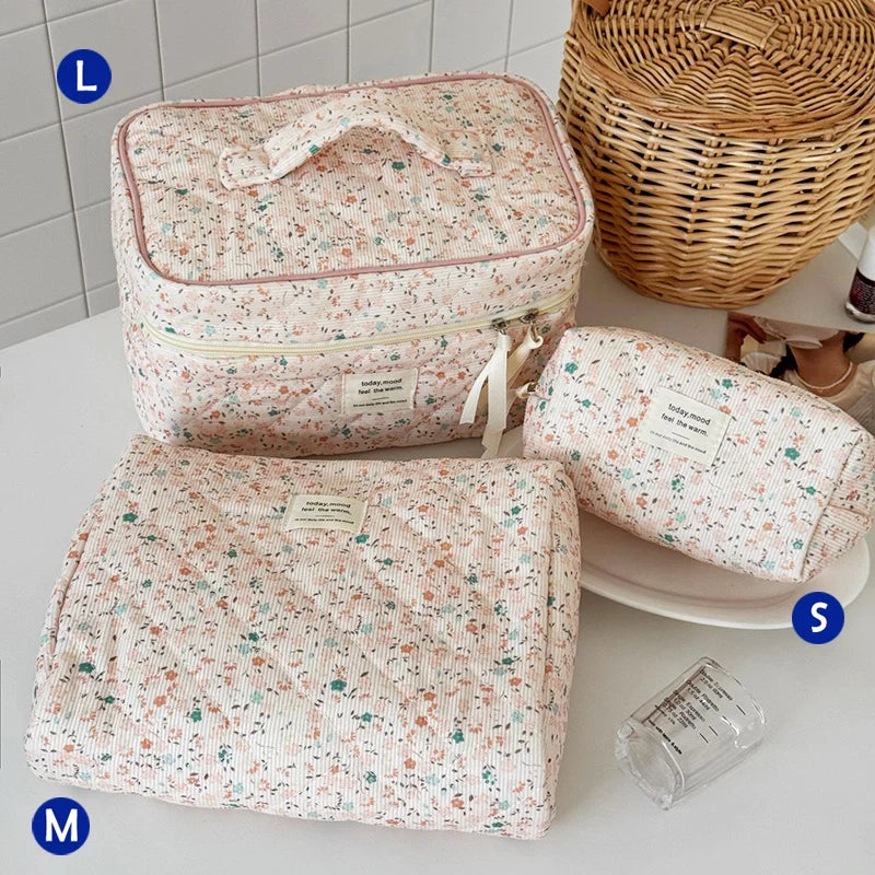 A quilted pink and white cotton makeup bag with a zipper closure is shown next to a folded version.