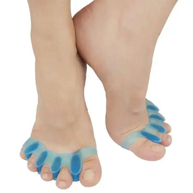 A pair of blue soft gel toe separators placed on a person's foot.