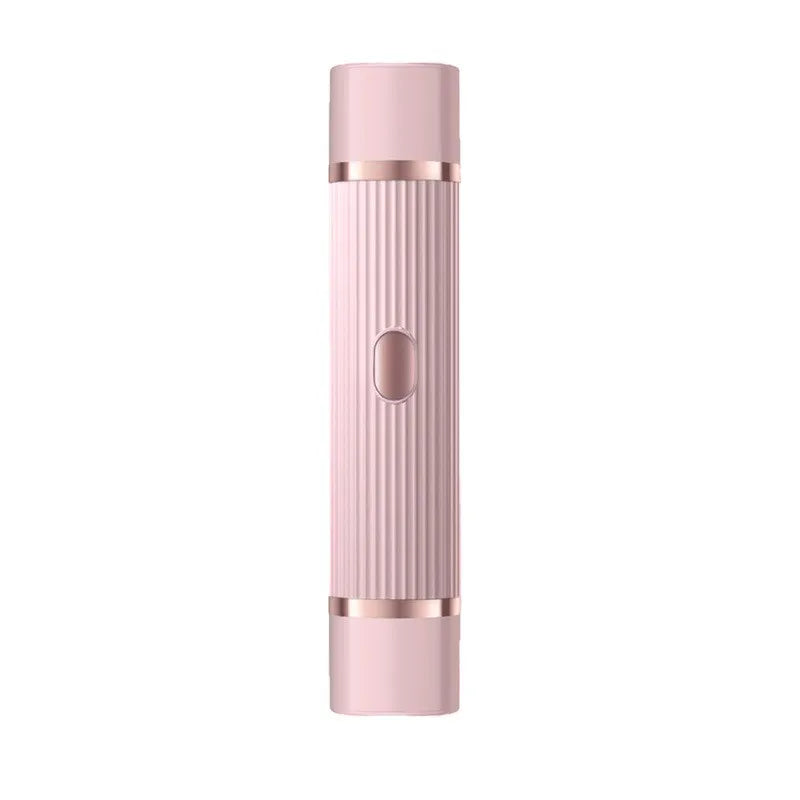 A pink portable dual-head electric shaver with a ribbed body and silver accents.