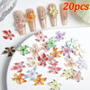 A set of 20 floral resin nail charms featuring hibiscus and various flower designs on a white background.